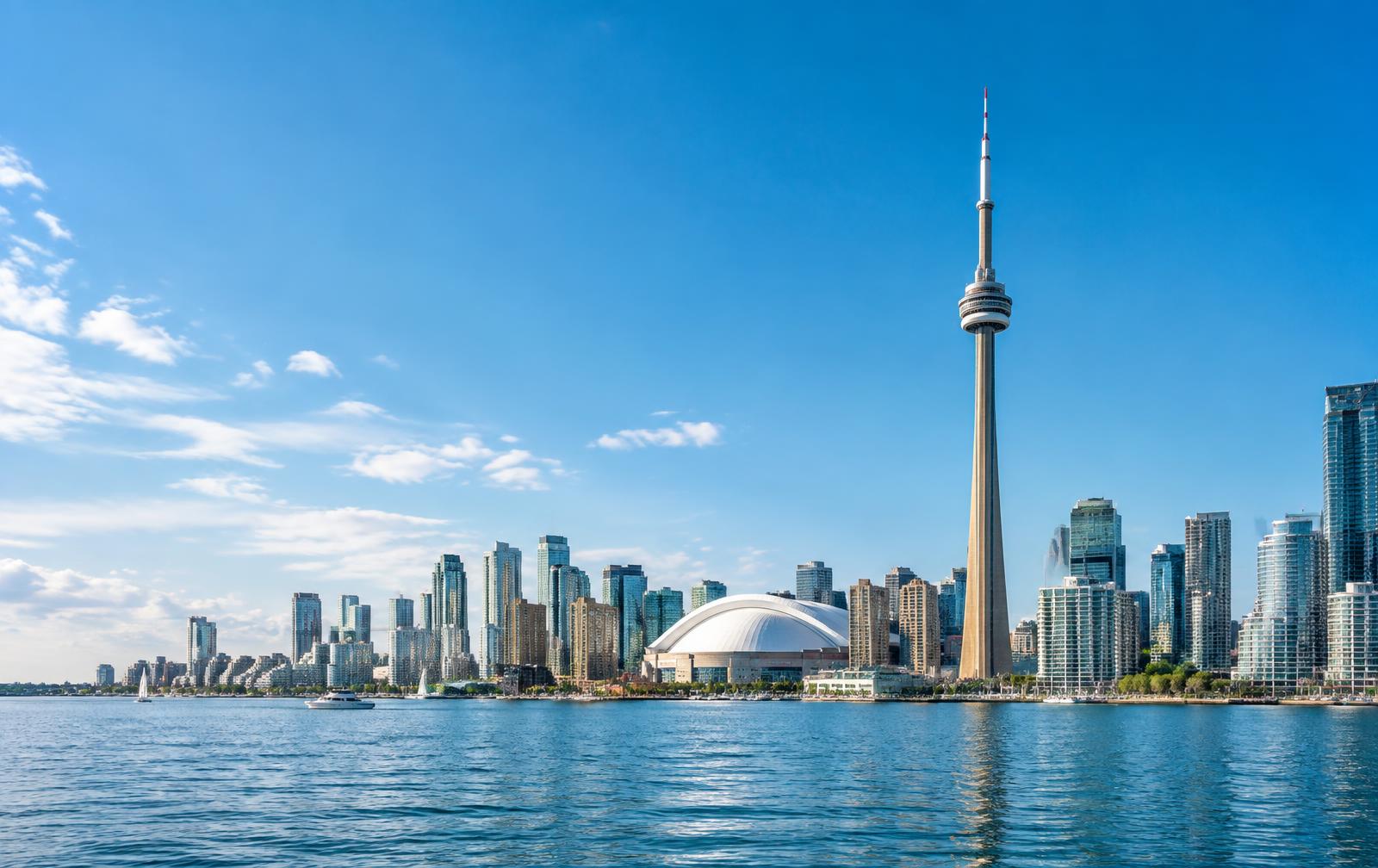 Toronto skyline and CN Tower beside Lake Ontario