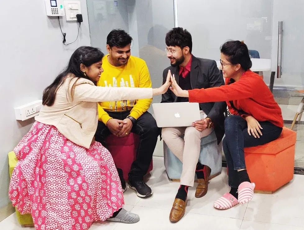 Visadesk team members working together in the Indore office